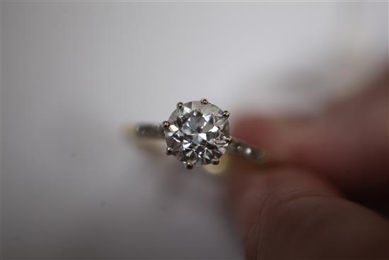 An 18ct gold and platinum solitaire diamond ring, size T.
